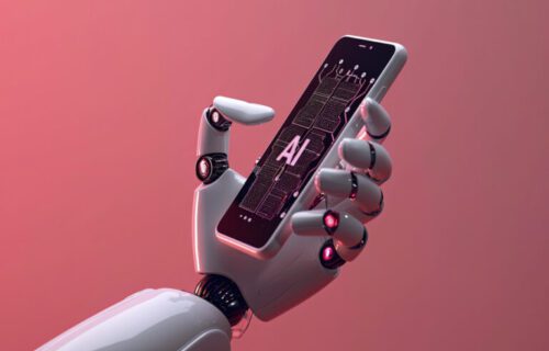 Robo segurando um Iphone (Celular da marca Apple) com AI (Inteligência artificial) escrito