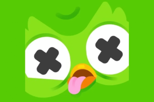 Imagem de um personagem de desenho animado verde com olhos grandes e cruzados, expressão divertida e língua de fora, ideal para conteúdo humorístico ou infantil.