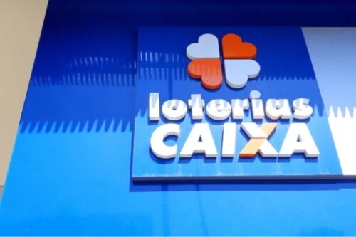Imagem da fachada da Lotéricas Caixa, com logotipo colorido e destaque em fundo azul, representando um ponto de venda de loterias no Brasil.