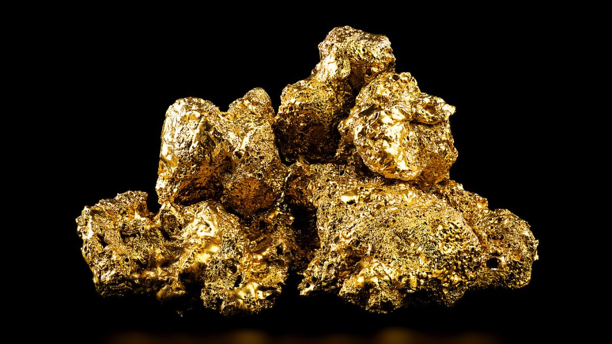 Ouro empilhado sobre fundo escuro