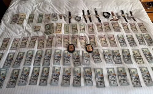 Dinheiro em dólares e relógios apreendidos pela Polícia Federal durante operação em Brasília ligados ao Caso Master.